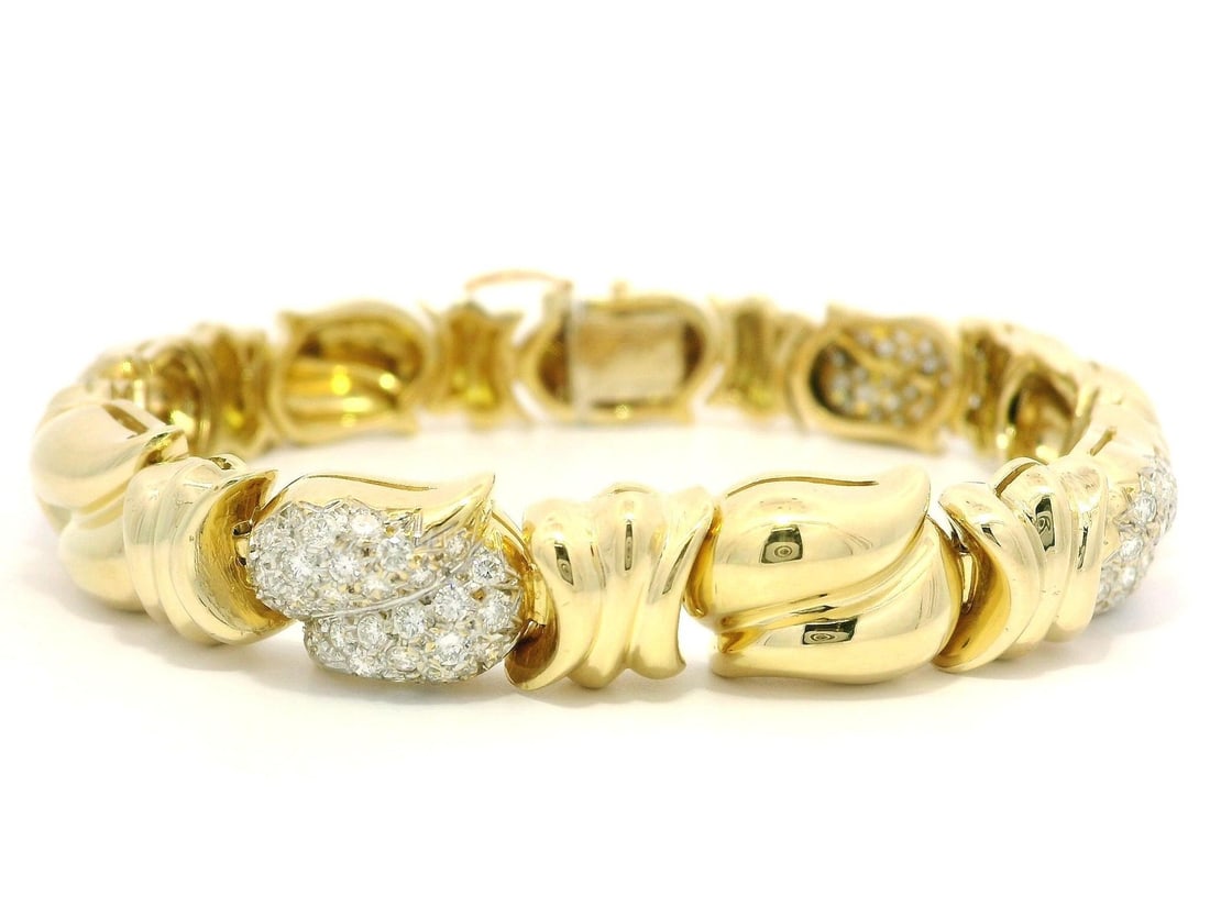 18k Yellow Gold 1.5ctw Diamond Puffed Teardrop Bracelet: 18k Yellow Gold 1.5ctw Diamond Puffed Teardrop Bracelet Indulge in the elegance of this exquisite 18k Yellow Gold bracelet, featuring a stunning array of 104 natural genuine diamonds. The bracelet sho