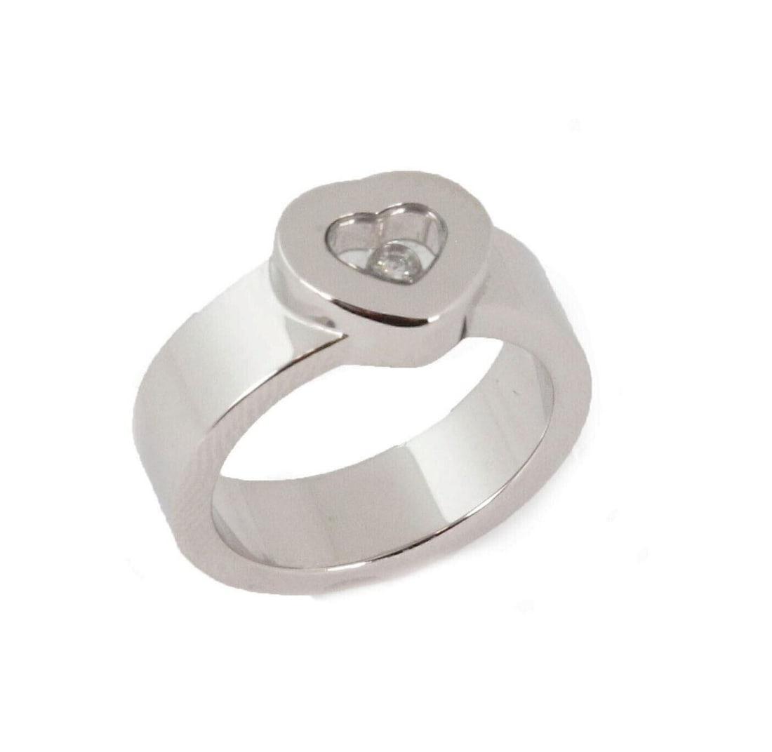 Happy Diamond Heart Ring by Chopard in 18k White Gold Size 6: Happy Diamond Heart Ring by Chopard in 18k White Gold Size 6 This Chopard Happy Diamond ring is crafted in 18k white gold and features a heart-shaped design. It showcases a round white diamond with a