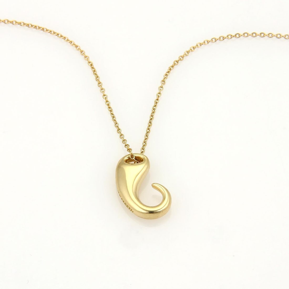 Tiffany & Co. Elsa Peretti 18K Yellow Gold Hook Necklace: Tiffany & Co. Elsa Peretti 18K Yellow Gold Hook Necklace This exquisite necklace is a stunning creation by Tiffany & Co., designed by Elsa Peretti. The piece features a polished 18k yellow gold pendan