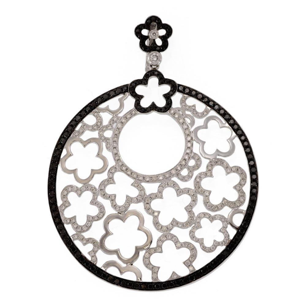 Stunning 3.10ct Black and White Diamond Floral Pendant in 18k Gold: Stunning 3.10ct Black and White Diamond Floral Pendant in 18k Gold This stunning contemporary pendant showcases a unique floral design, expertly crafted from 18k white gold with black gold accents. Th