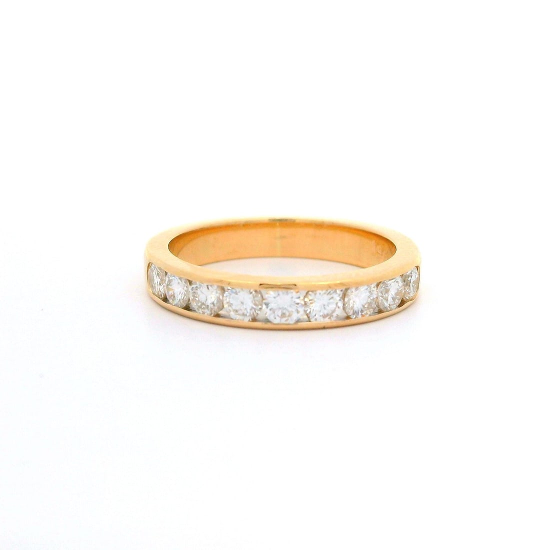 Elegant 14k Yellow Gold Diamond Channel Wedding Band Ring 0.70ctw: Elegant 14k Yellow Gold Diamond Channel Wedding Band Ring 0.70ctw This elegant wedding band features a classic design crafted from solid 14k yellow gold, showcasing a total of nine natural diamonds. T
