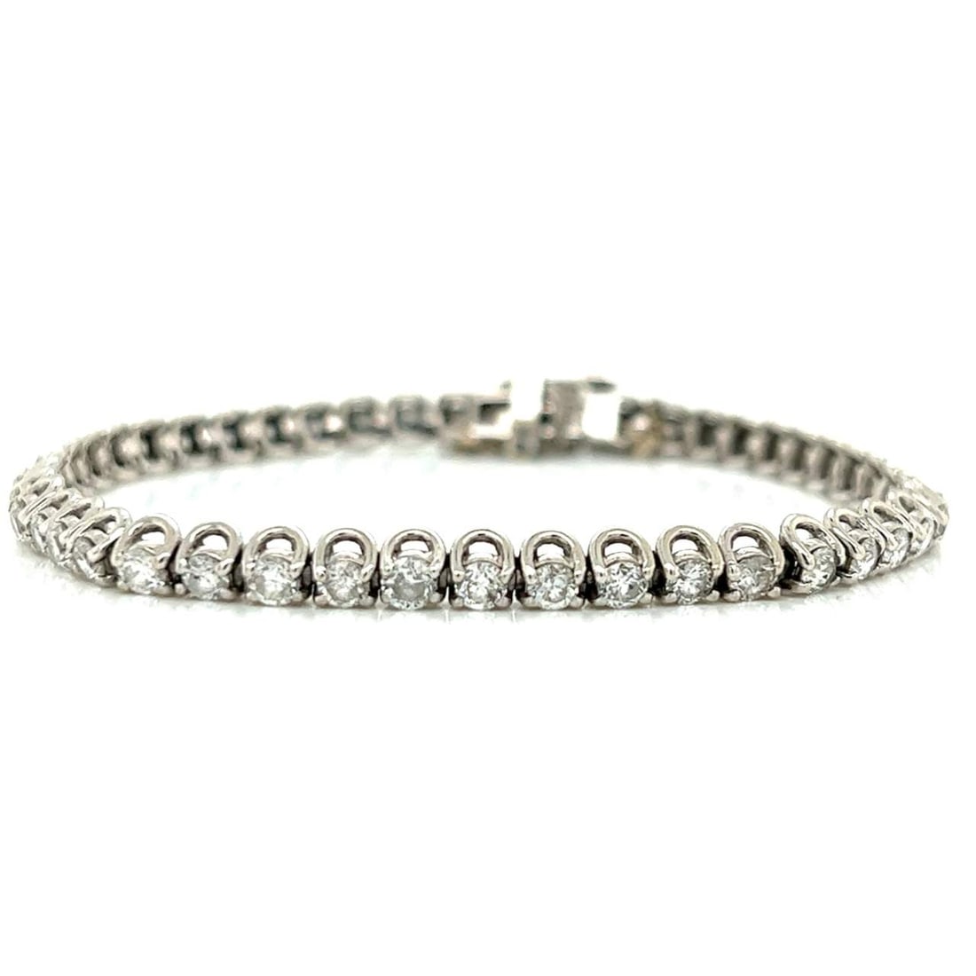 14K White Gold 5.00 Ct Diamond Tennis Bracelet 46 Diamonds G-H VS2-SI2: 14K White Gold 5.00 Ct Diamond Tennis Bracelet 46 Diamonds G-H VS2-SI2 This exquisite 14K White Gold Tennis Bracelet showcases a stunning collection of 46 diamonds, with a total weight of approximatel