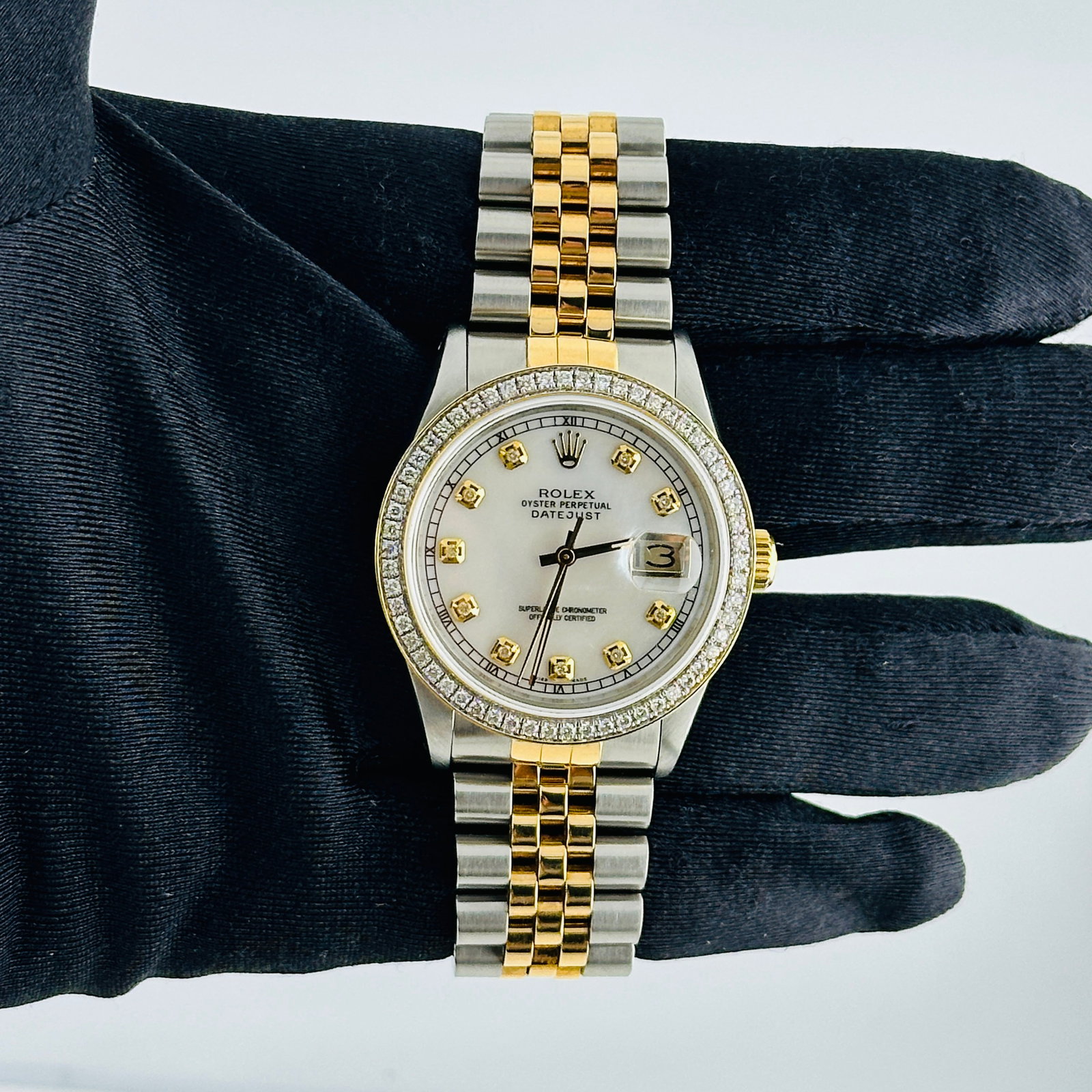 Rolex Datejust Ref 16013 Aftermarket White MOP Diamond Dial Jubilee Bracelet: Rolex Datejust Ref 16013 Aftermarket White MOP Diamond Dial Jubilee Bracelet This Rolex Datejust features a white mother of pearl diamond dial and a pave 10K diamond bezel, complemented by a D-Link Ju