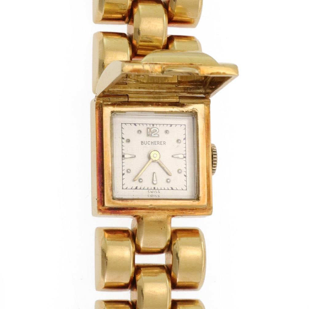 Bucherer 18k Yellow Gold Hidden Watch Bracelet with Diamonds: Bucherer 18k Yellow Gold Hidden Watch Bracelet with Diamonds This exquisite vintage bracelet and watch by Bucherer combines elegance and functionality. Crafted from luxurious 18k yellow gold, it featu