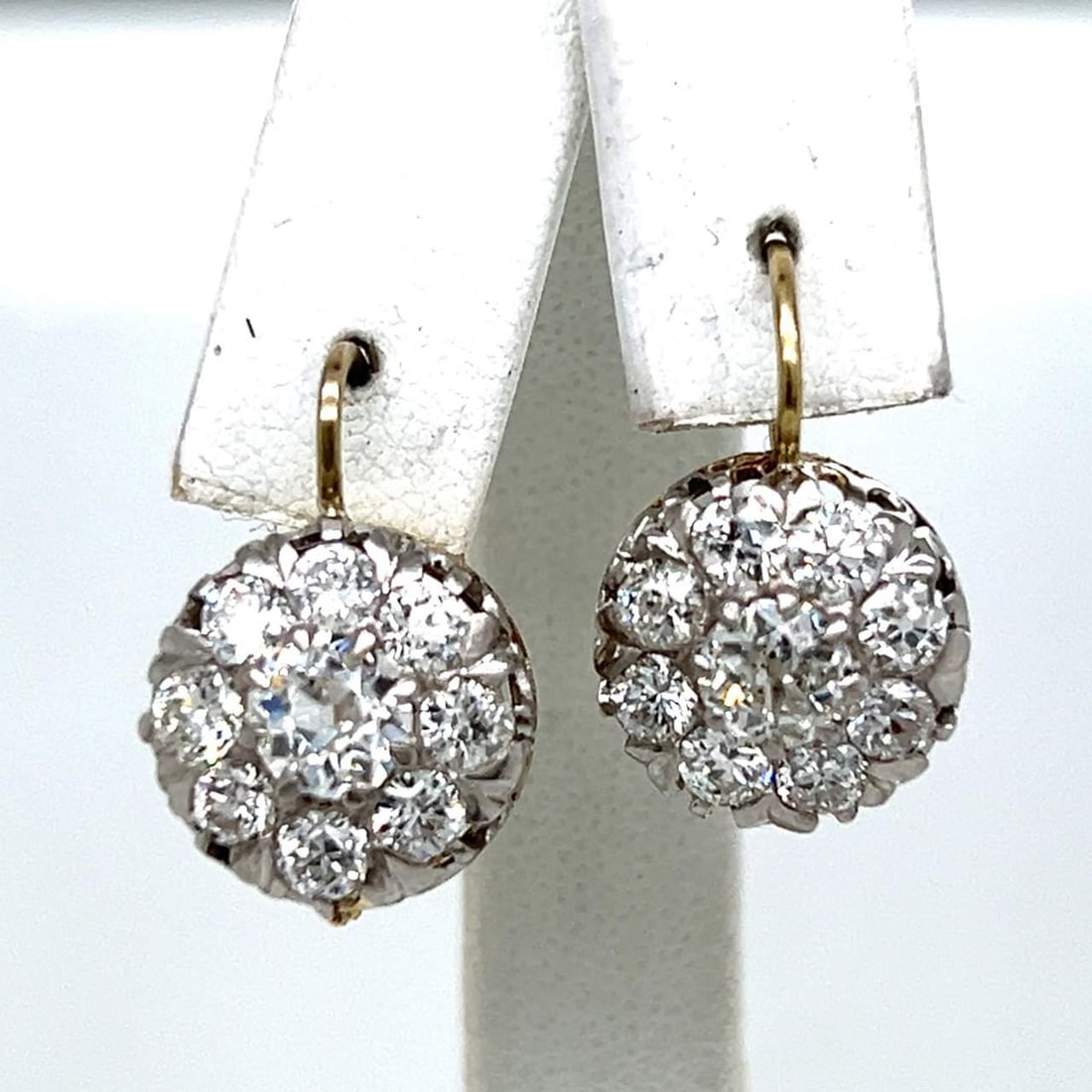 Platinum 18K Gold 3.15 Ct Old Mine Diamond Earrings: Platinum 18K Gold 3.15 Ct Old Mine Diamond Earrings Elevate your elegance with these exquisite Platinum and 18K Yellow Gold earrings, featuring a stunning total weight of 3.15 carats in diamonds. Craf