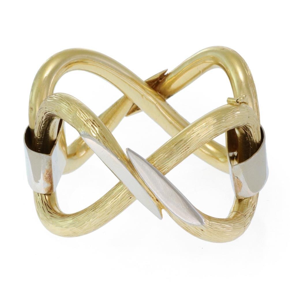 Chic 18k Gold Double Figure 8 Link Bracelet 92g: Chic 18k Gold Double Figure 8 Link Bracelet 92g This stunning large bracelet showcases the elegance of 18k yellow and white gold, designed with a chic brush textured finish. The bracelet features a su