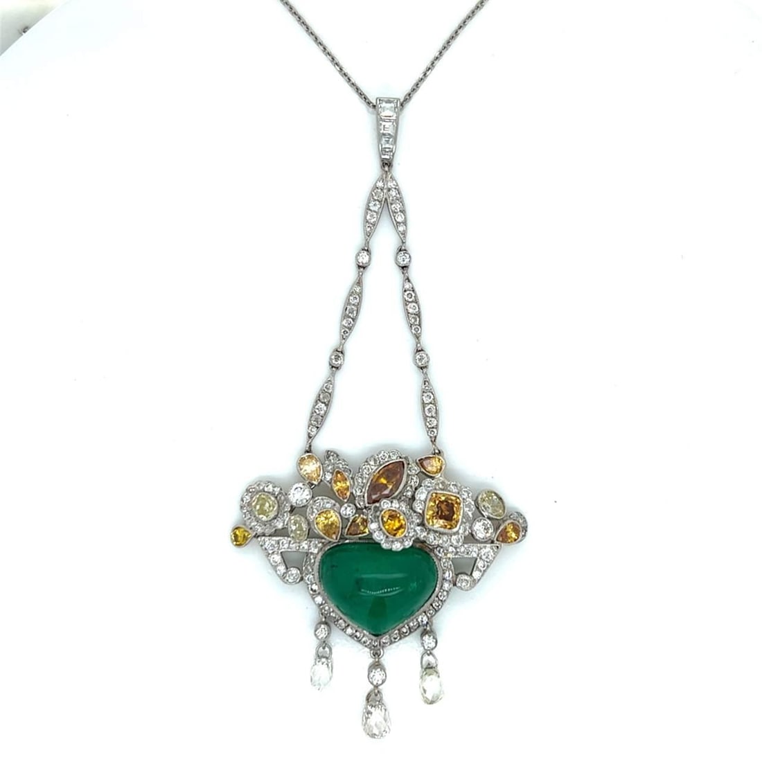 Stunning Platinum Necklace with Emerald and Natural Color Diamonds: Stunning Platinum Necklace with Emerald and Natural Color Diamonds This exquisite necklace features a stunning combination of platinum, emerald, and natural color diamonds. The necklace weighs 13.9 gr