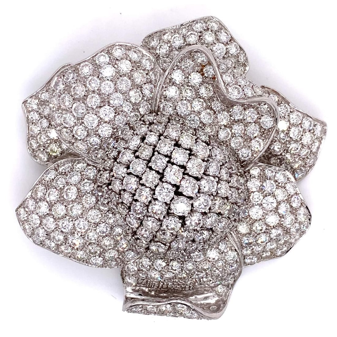 35 Ct Diamond Flower Brooch in 18k White Gold: 35 Ct Diamond Flower Brooch in 18k White Gold This exquisite diamond flower brooch features approximately 35.00 carats of dazzling diamonds, showcasing F-G color and VVS-VS clarity. Crafted from luxur