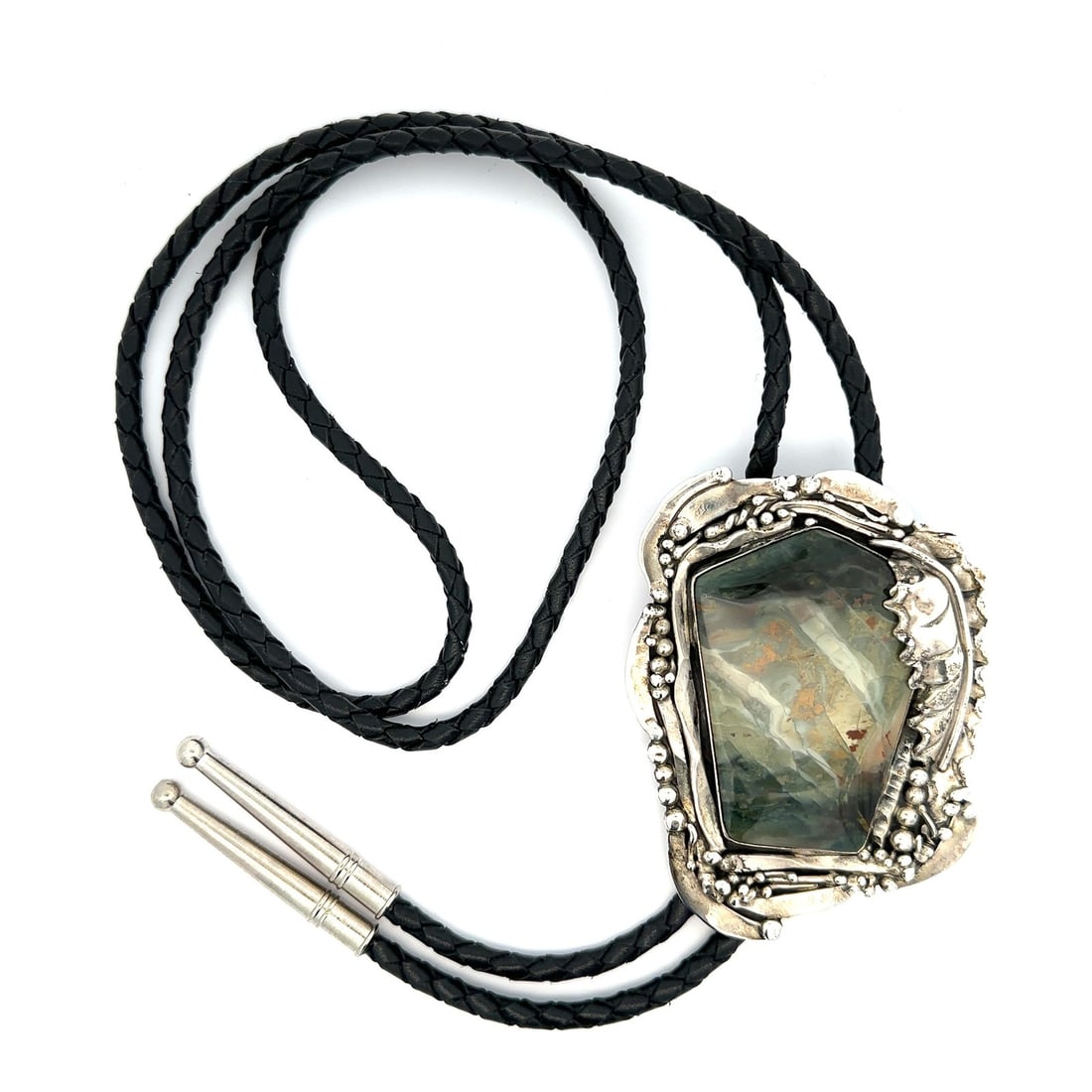 Stan Davidson Navajo Sterling Silver Moss Agate Bolo Tie with Black Leather Cord: Stan Davidson Navajo Sterling Silver Moss Agate Bolo Tie with Black Leather Cord This vintage Navajo bolo tie by Stan Davidson features a custom-cut, natural moss agate stone with green, white, and br