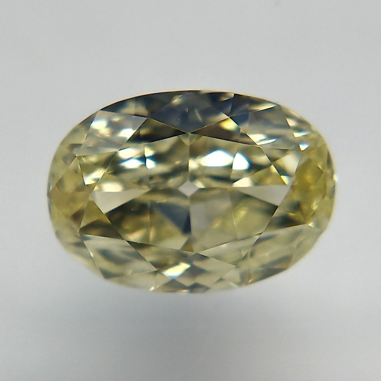 Loose Diamond - OVAL 0.52ct Fancy Light Yellow VS1: Loose Diamond - OVAL 0.52ct Fancy Light Yellow VS1 Source: Natural Shape: OVAL Carats: 0.52 Color: Fancy Light Yellow Certification: GIA PLEASE NOTE: Framed, Large, or heavy items do not have shipping