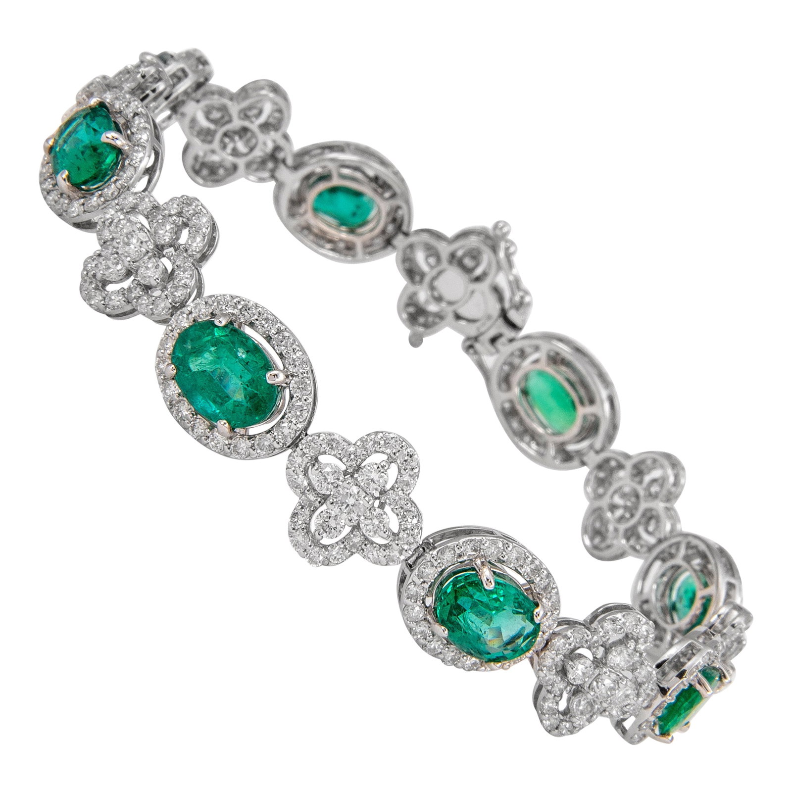 13.25 Carat Emerald Diamond Bracelet 18k White Gold Contemporary: 13.25 Carat Emerald Diamond Bracelet 18k White Gold Contemporary This exquisite and elegant bracelet features a stunning combination of emeralds and diamonds set in luxurious 18k white gold. The brace