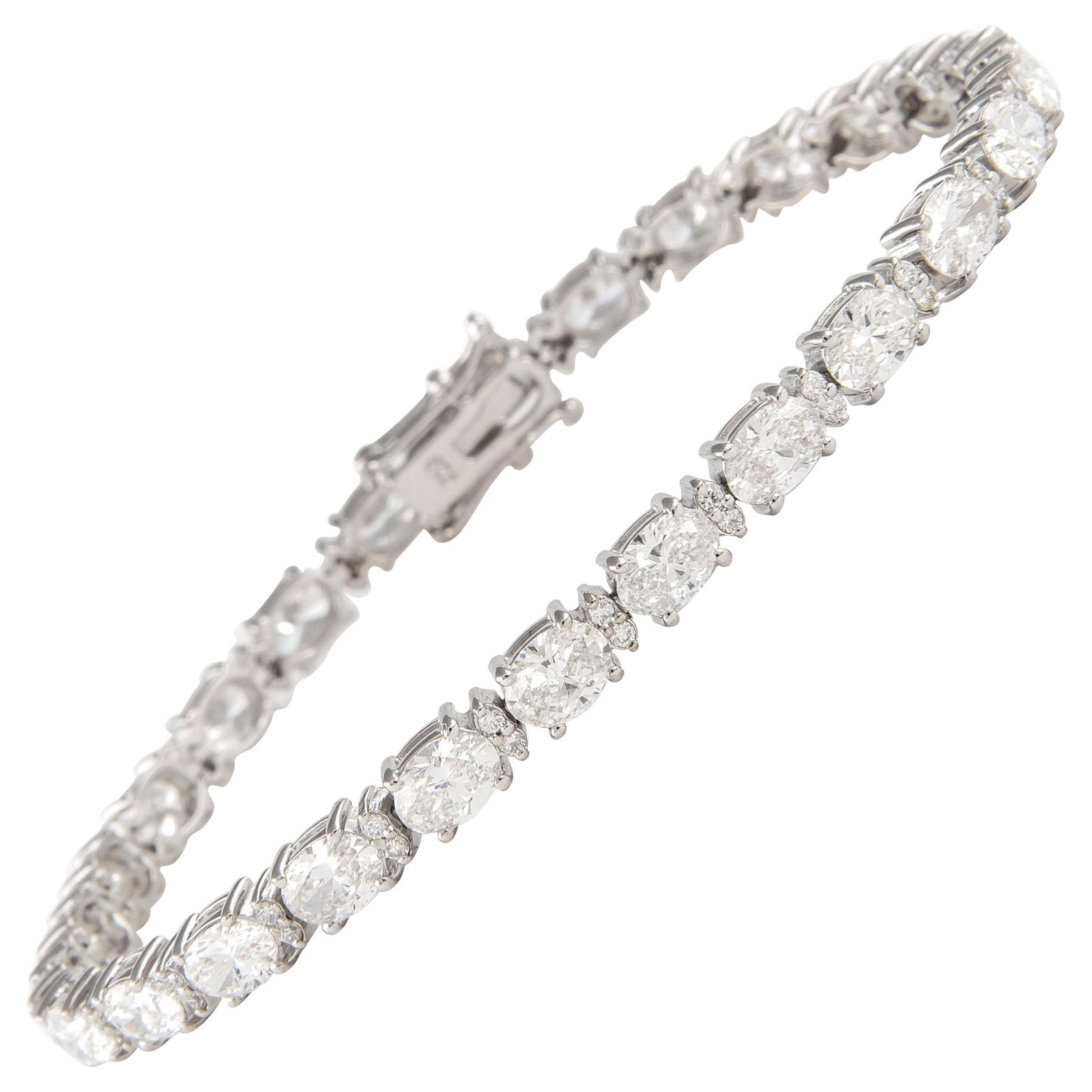 8.76ct Oval Diamond Tennis Bracelet 18k White Gold: 8.76ct Oval Diamond Tennis Bracelet 18k White Gold This exquisite 8.76ct Oval Diamond East-West Tennis Bracelet showcases a stunning contemporary design crafted in 18k white gold. The bracelet feature
