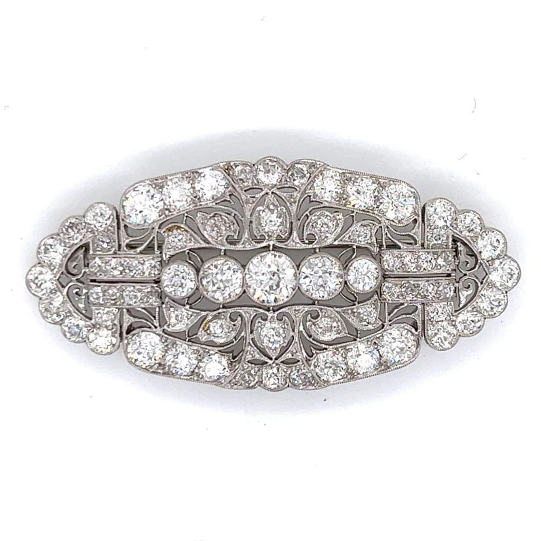 Art Deco Platinum Brooch 6.50 Ct Old Mine Diamonds G-H VS1-VS2: Art Deco Platinum Brooch 6.50 Ct Old Mine Diamonds G-H VS1-VS2 This exquisite Art Deco brooch is crafted from platinum and features a stunning arrangement of 67 Old Mine Diamonds, with a total weight