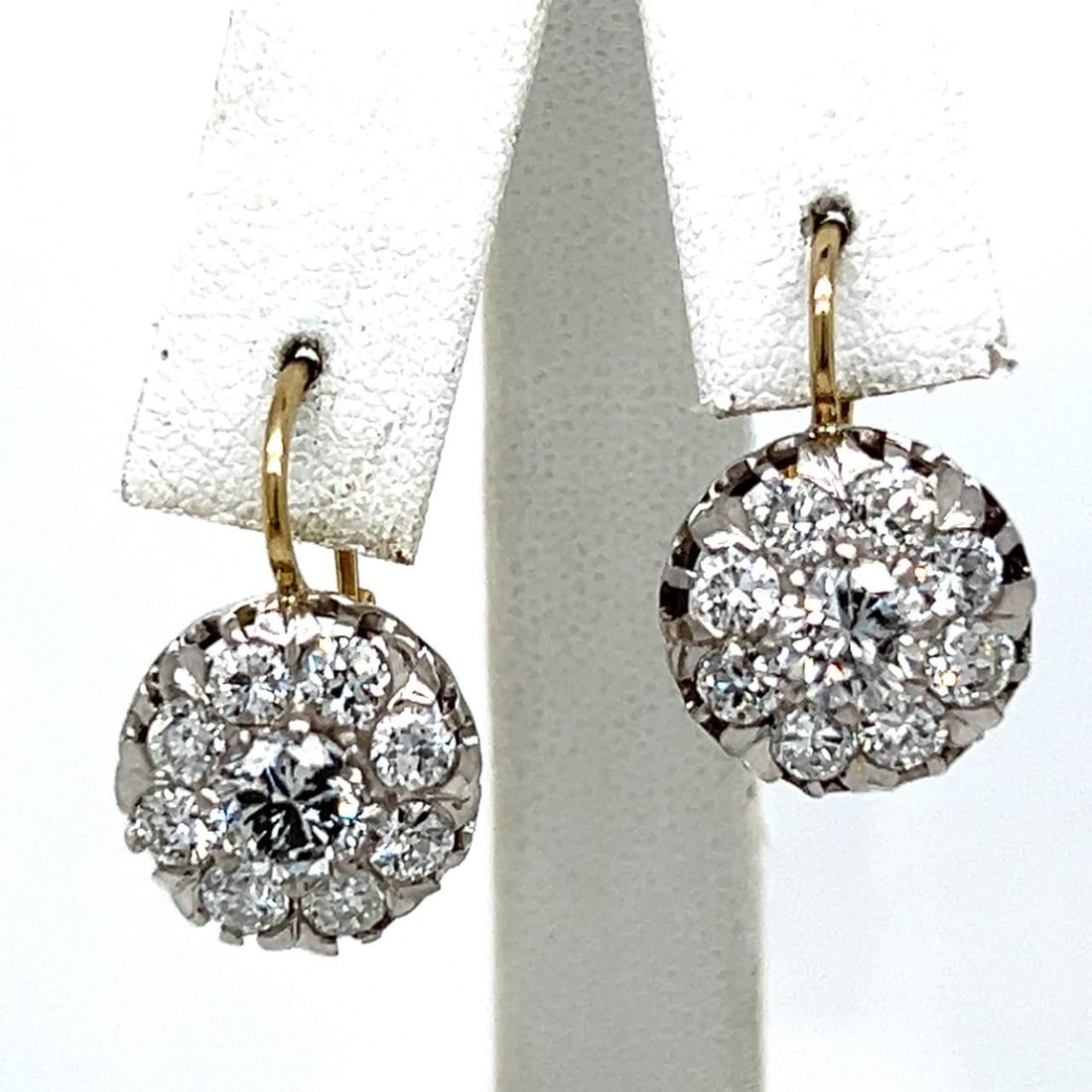 Elegant 18K Platinum Diamond Earrings 3.80 Ct G-H Color: Elegant 18K Platinum Diamond Earrings 3.80 Ct G-H Color Experience elegance with these stunning 18K and Platinum diamond earrings. Each earring features two exquisite diamonds, totaling approximately