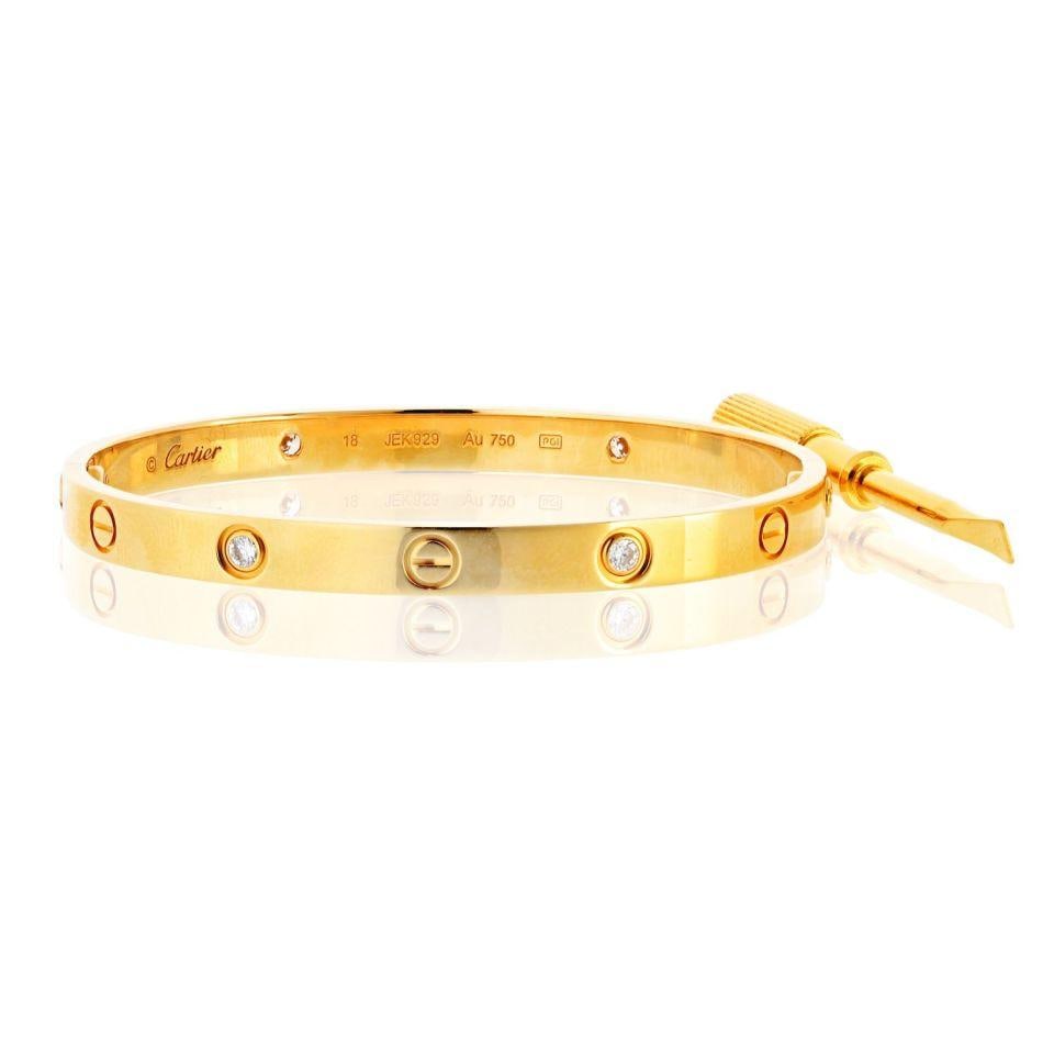 Cartier Love Bracelet 18K Yellow Gold with 4 Diamonds Size 18: Cartier Love Bracelet 18K Yellow Gold with 4 Diamonds Size 18 This exquisite Cartier Love bracelet is crafted from 18K yellow gold, showcasing a sleek and timeless design. The bracelet features four s
