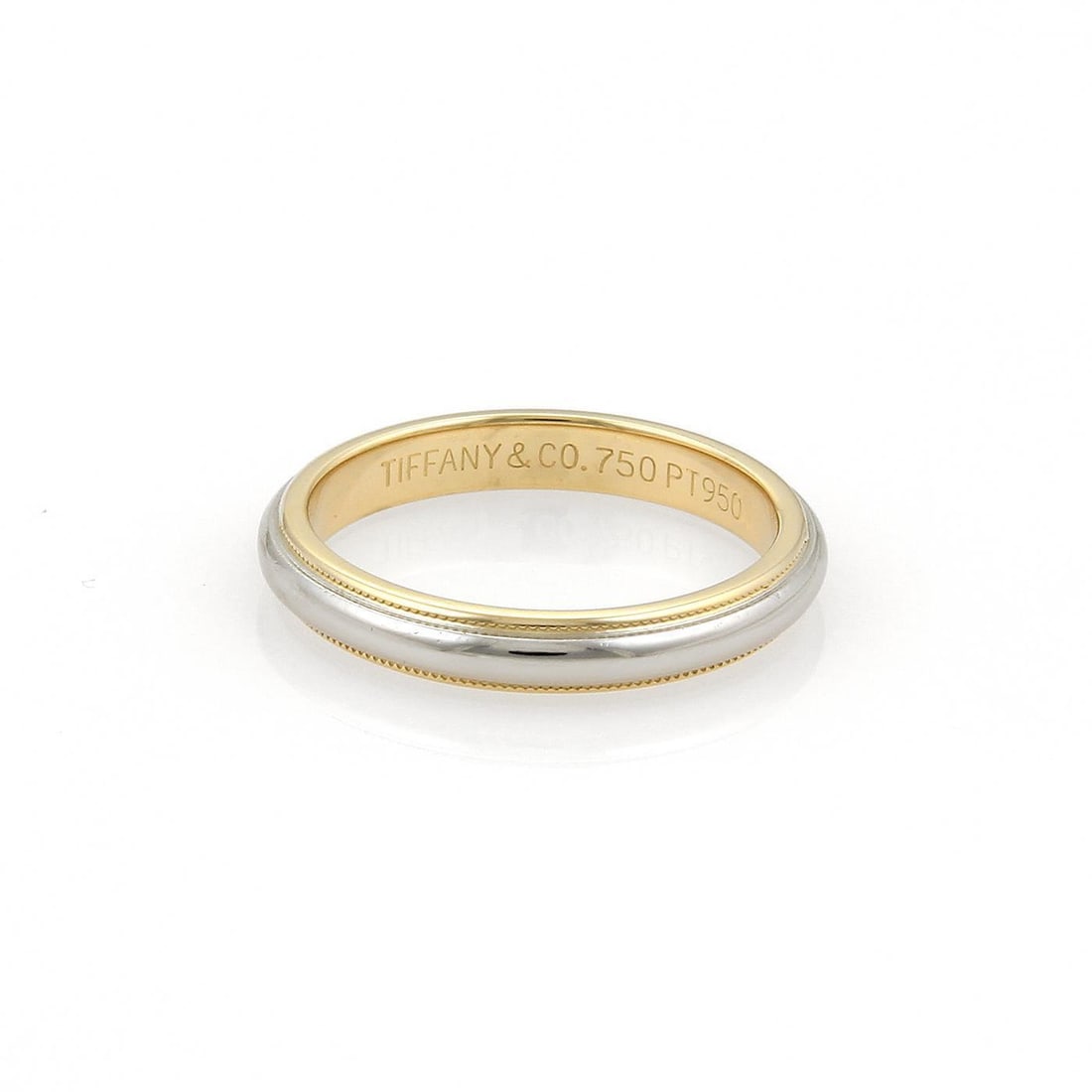 Tiffany & Co Platinum 18k Yellow Gold Wedding Band 3.5mm Milgrain: Tiffany & Co Platinum 18k Yellow Gold Wedding Band 3.5mm Milgrain This exquisite Tiffany & Co. wedding band showcases a harmonious blend of platinum and 18k yellow gold. The ring features a high-polis