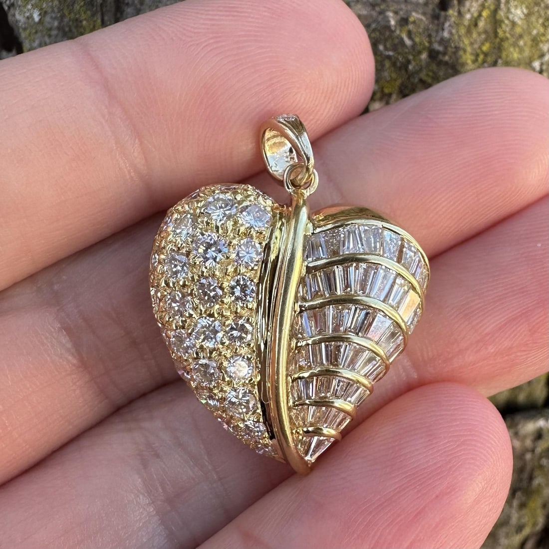 Heart Pendant in 18k Yellow Gold with 2.5ctw Round and Baguette Diamonds: Heart Pendant in 18k Yellow Gold with 2.5ctw Round and Baguette Diamonds This unique pendant features a half-half heart design crafted in solid 18k yellow gold with a 14k yellow gold bail. The pendant