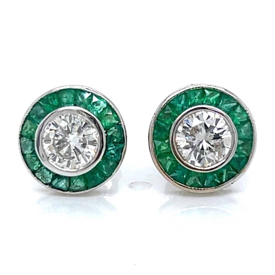 Diamond and Emerald Studs in 18K White Gold with 0.84 Ct Diamonds: Diamond and Emerald Studs in 18K White Gold with 0.84 Ct Diamonds These stud earrings feature 18K white gold settings adorned with two diamonds totaling 0.84 carats, showcasing I-J color and VS1-SI1 c