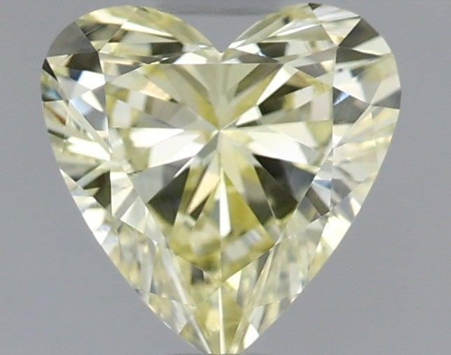Loose Diamond - HEART 0.75ct Fancy Yellow VVS2: Loose Diamond - HEART 0.75ct Fancy Yellow VVS2 Source: This is a real non-mined Diamond that has been grown in a lab Shape: HEART Carats: 0.75 Color: Fancy Yellow Certification: IGI Video: