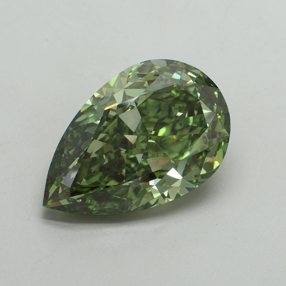 Loose Diamond - PEAR 11.51ct Fancy Vivid Green VS1: Loose Diamond - PEAR 11.51ct Fancy Vivid Green VS1 Source: This is a real non-mined Diamond that has been grown in a lab Shape: PEAR Carats: 11.51 Color: Fancy Vivid Green Certification: IGI Video: