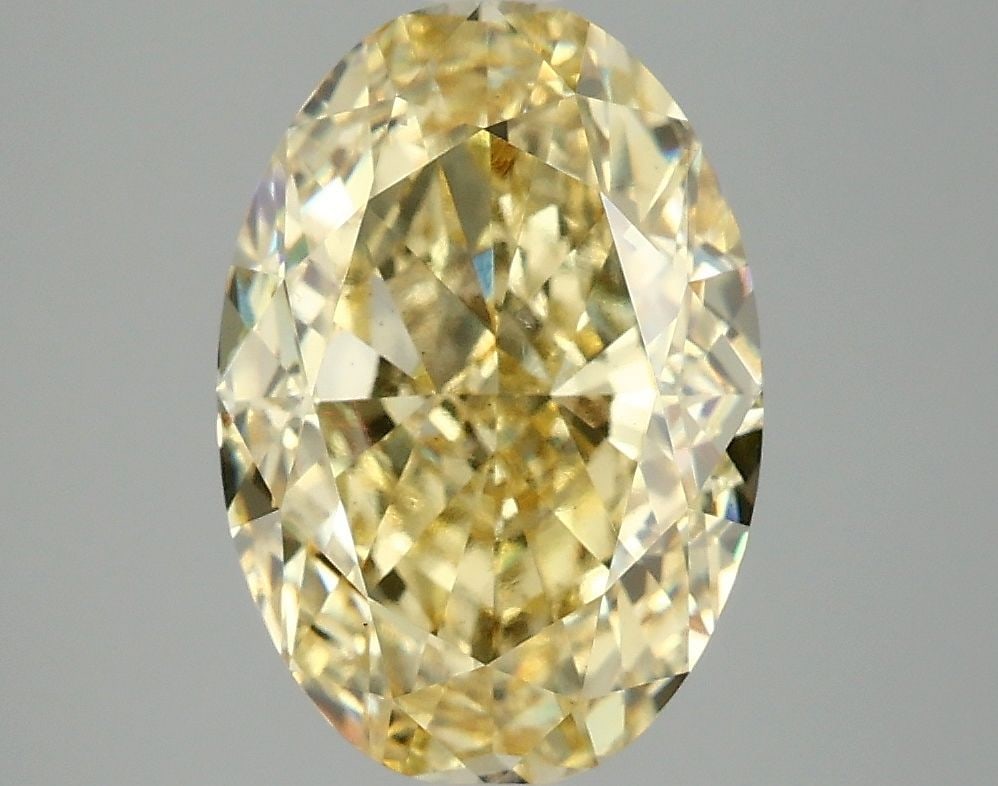 Loose Diamond - OVAL 4.1ct Fancy Vivid Yellow VS2: Loose Diamond - OVAL 4.1ct Fancy Vivid Yellow VS2 Source: This is a real non-mined Diamond that has been grown in a lab Shape: OVAL Carats: 4.1 Color: Fancy Vivid Yellow Certification: IGI Video: