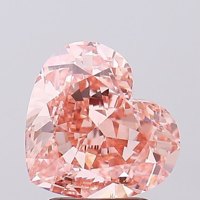 Loose Diamond - HEART 3.11ct Fancy Intense Orangey Pink VS1: Loose Diamond - HEART 3.11ct Fancy Intense Orangey Pink VS1 Source: This is a real non-mined Diamond that has been grown in a lab Shape: HEART Carats: 3.11 Color: Fancy Intense Orangey Pink Certificat