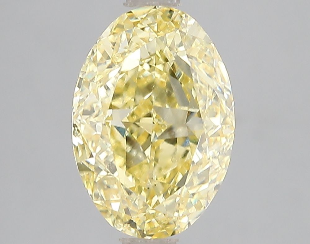 Loose Diamond - OVAL 3.08ct Fancy Vivid Yellow VS1: Loose Diamond - OVAL 3.08ct Fancy Vivid Yellow VS1 Source: This is a real non-mined Diamond that has been grown in a lab Shape: OVAL Carats: 3.08 Color: Fancy Vivid Yellow Certification: IGI Video: