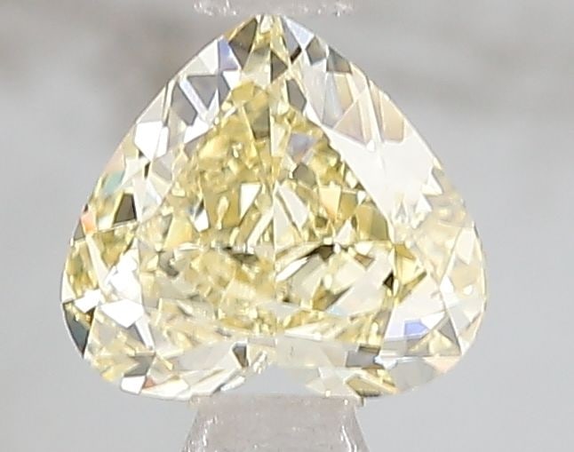 Loose Diamond - HEART 1.01ct Fancy Yellow VS1: Loose Diamond - HEART 1.01ct Fancy Yellow VS1 Source: This is a real non-mined Diamond that has been grown in a lab Shape: HEART Carats: 1.01 Color: Fancy Yellow Certification: IGI PLEASE NOTE: Framed