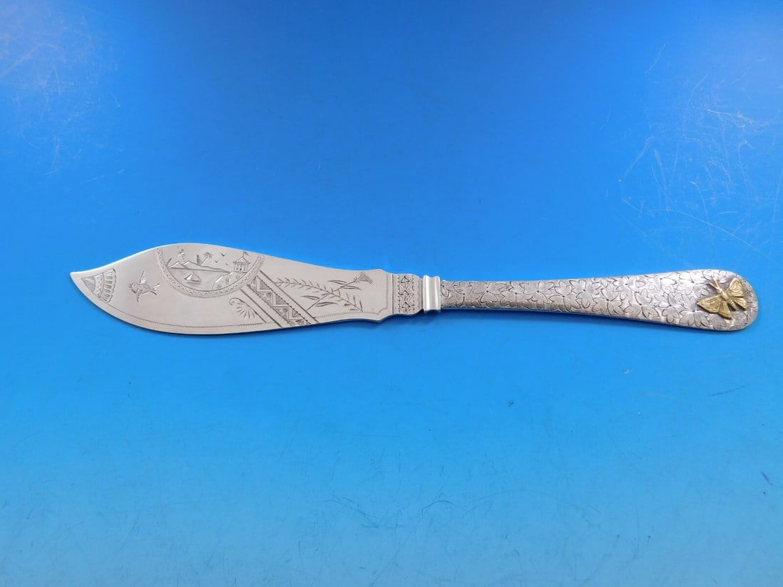 Dominick & Haff Sterling Silver Master Butter Knife with Gold Butterfly Motif: Dominick & Haff Sterling Silver Master Butter Knife with Gold Butterfly Motif Experience the elegance of this exquisite master butter knife crafted by Dominick & Haff. This stunning piece features a b