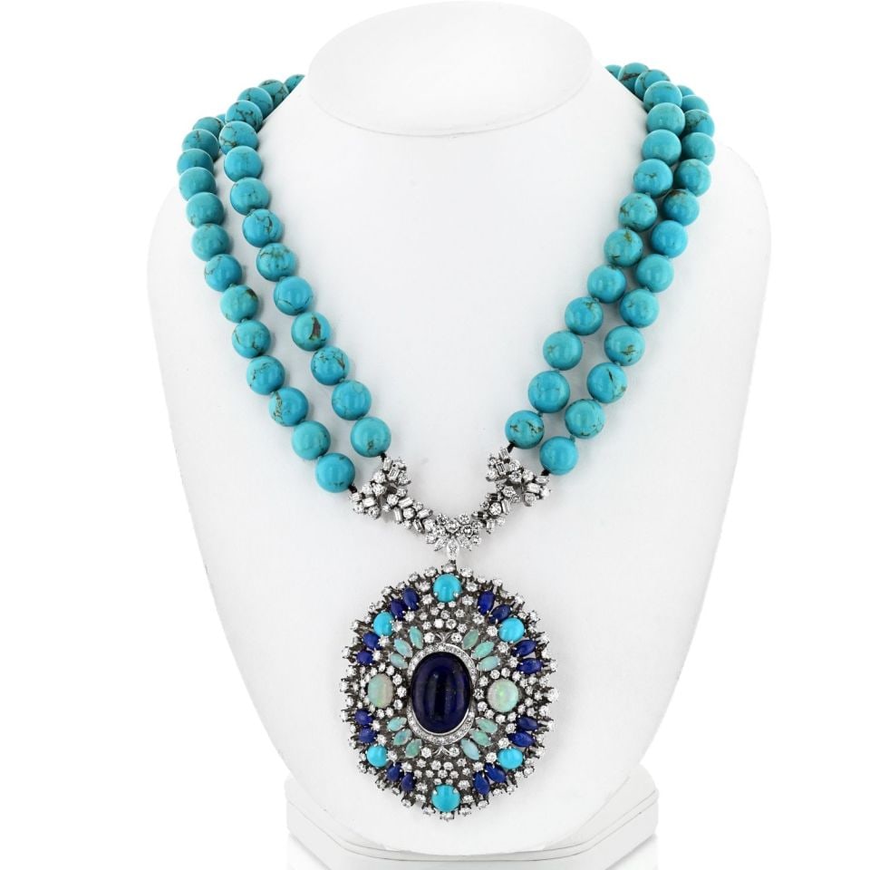 1970s 14K White Gold Turquoise Opal Diamond Sapphire Necklace: 1970s 14K White Gold Turquoise Opal Diamond Sapphire Necklace This exquisite necklace, crafted in the 1970s, features a stunning combination of opals, turquoise, diamonds, and sapphires, perfect for a