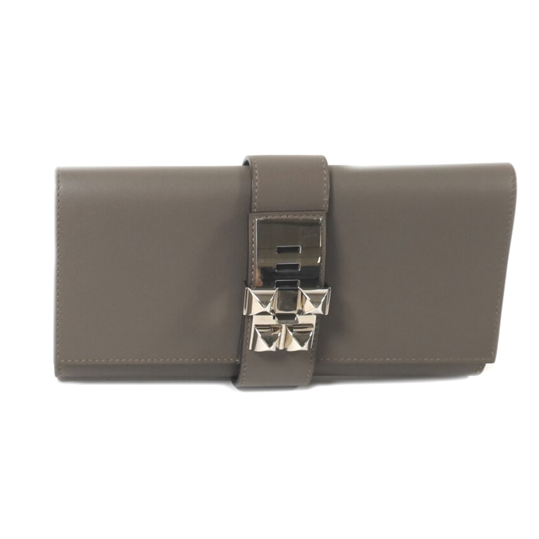 Medor Etain Clutch in Veau Swift Leather with Palladium by Hermes: Medor Etain Clutch in Veau Swift Leather with Palladium by Hermes This Hermes Medor clutch bag is crafted from Etain gray Veau Swift calfskin leather and features palladium hardware. Made in France, i
