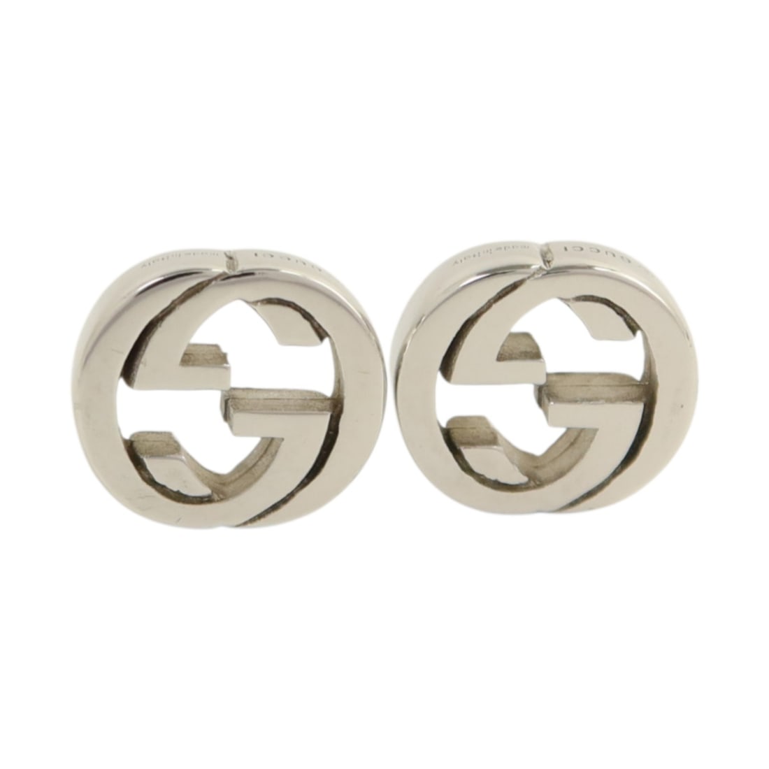 GUCCI Silver 925 GG Logo Pierced Earrings for Women: GUCCI Silver 925 GG Logo Pierced Earrings for Women These Gucci GG earrings are crafted from 925 sterling silver and designed for pierced ears. Featuring a classic silver tone and minimalist style, th
