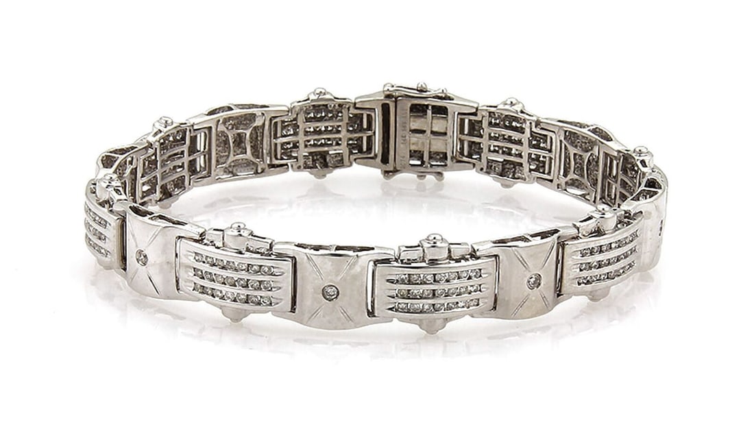 Vintage 14k White Gold Link Bracelet with Channel Set Diamonds: Vintage 14k White Gold Link Bracelet with Channel Set Diamonds This vintage bracelet features channel set diamonds in a curved link design, crafted from 14k white gold. Showcasing classic elegance and