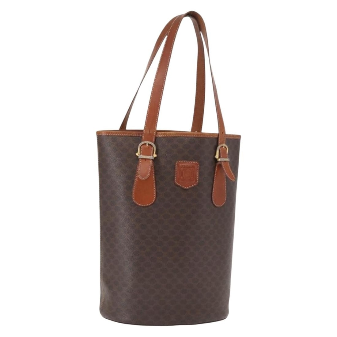 Celine Macadam Brown PVC and Leather Tote Bag Gold Accents: Celine Macadam Brown PVC and Leather Tote Bag Gold Accents This CELINE Macadam Canvas tote bag features a brown and gold color scheme with PVC leather and signature Macadam canvas materials. Designed