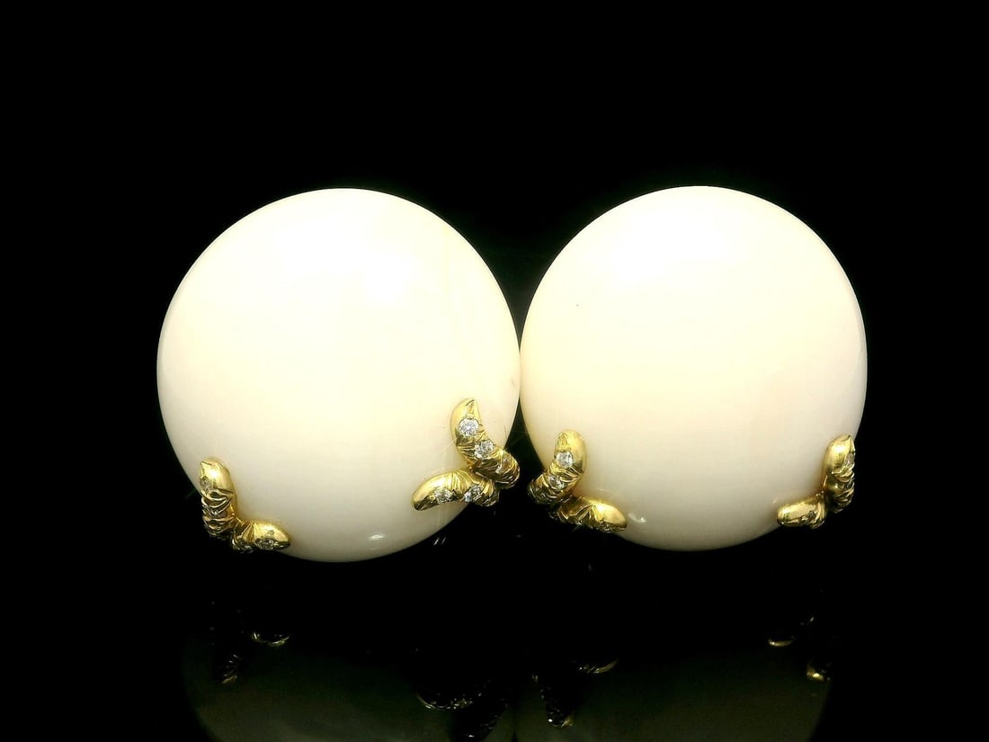 Henry Dunay 18k Gold White Coral Diamond Clip-On Earrings: Henry Dunay 18k Gold White Coral Diamond Clip-On Earrings Stunningly crafted by Henry Dunay, these 18k Gold Clip-On Earrings feature exquisite White Angel Skin Coral and sparkling diamonds. Each earri