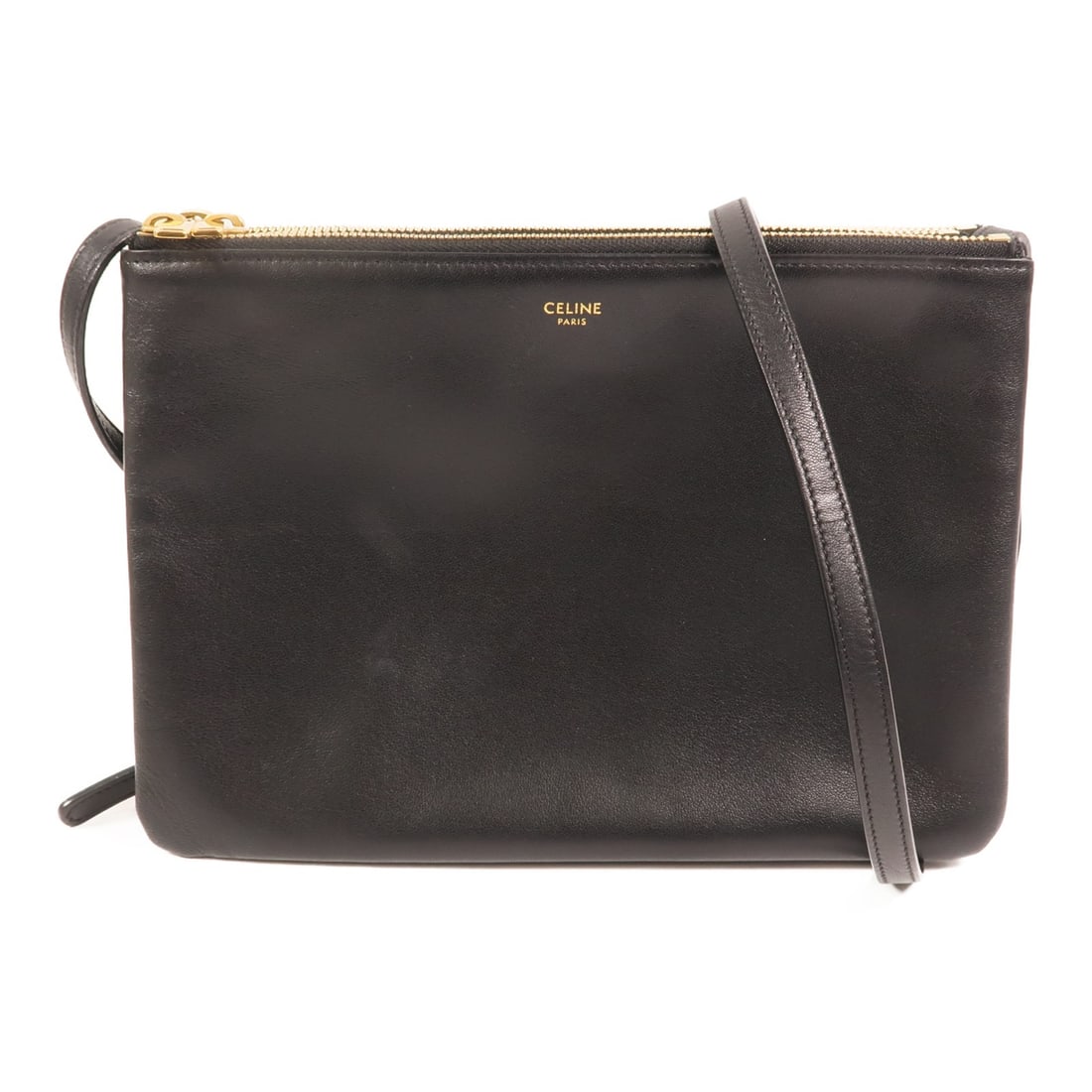 Celine Trio Black Calfskin Leather Shoulder Bag with Gold Hardware: Celine Trio Black Calfskin Leather Shoulder Bag with Gold Hardware This Celine Trio shoulder bag is crafted from black calfskin leather and features a classic, minimalist design. The bag is designed f