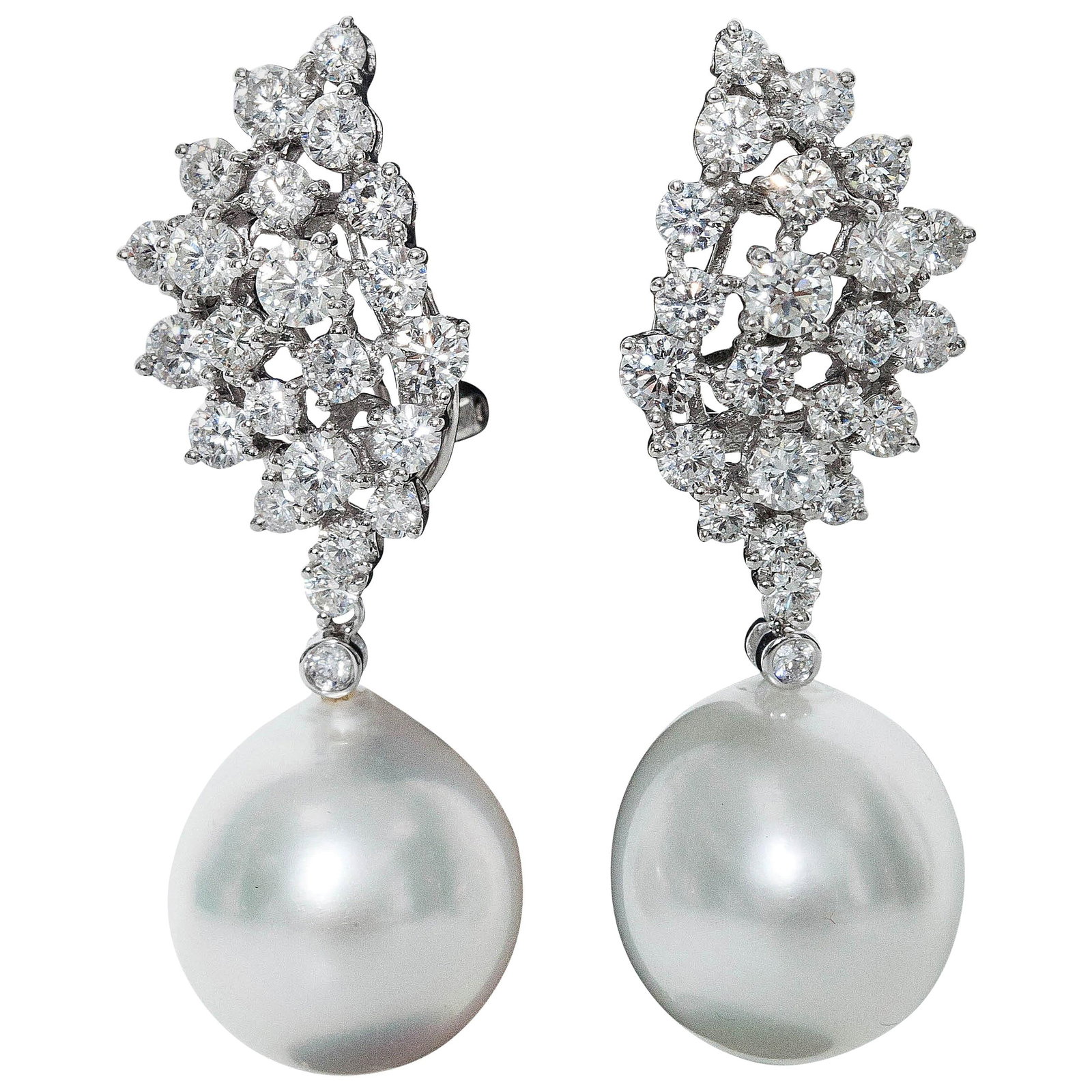 South Sea Pearl and Diamond Drop Earrings in 18K White Gold 2.7 CT 13-14mm: South Sea Pearl and Diamond Drop Earrings in 18K White Gold 2.7 CT 13-14mm These contemporary drop earrings feature South Sea cultured pearls paired with a cluster of round-cut diamonds set in 18K whi