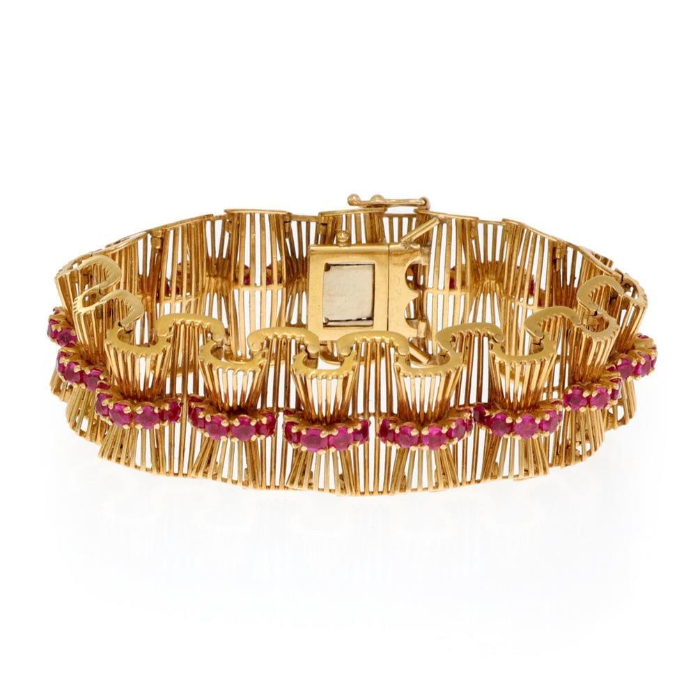 Tiffany & Co. 18k Yellow Gold Ruby Bow Tie Bracelet: Tiffany & Co. 18k Yellow Gold Ruby Bow Tie Bracelet This exquisite bracelet from Tiffany & Co. captures the essence of the Retro Era, showcasing a stunning design crafted from 18k yellow gold with a p