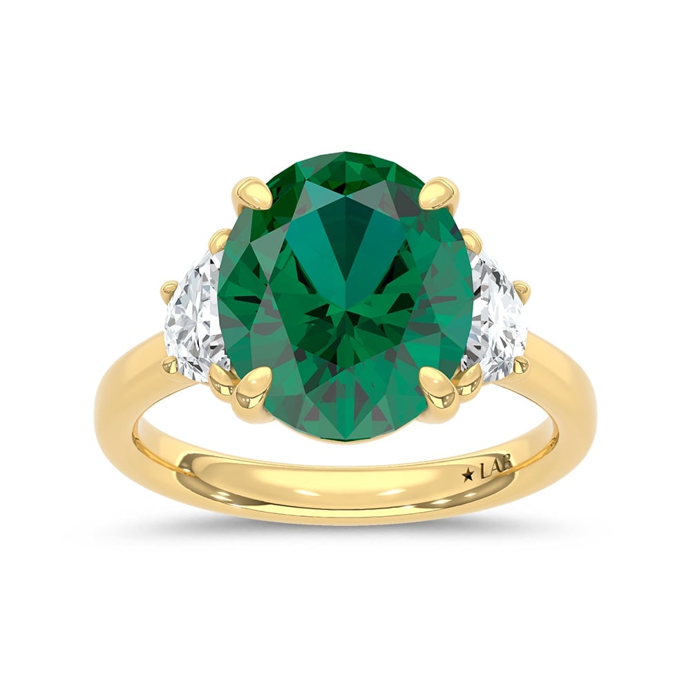 14K Yellow Gold Lab Grown Diamond 5 1/2 Ct.Tw. Oval Shape Recrystalized Emerald Engagement Ring: 14K Yellow Gold Lab Grown Diamond 5 1/2 Ct.Tw. Oval Shape Recrystalized Emerald Engagement Ring (Center 5 ct) Celebrate refined elegance with this 14K yellow gold engagement ring. Its centerpiece is a