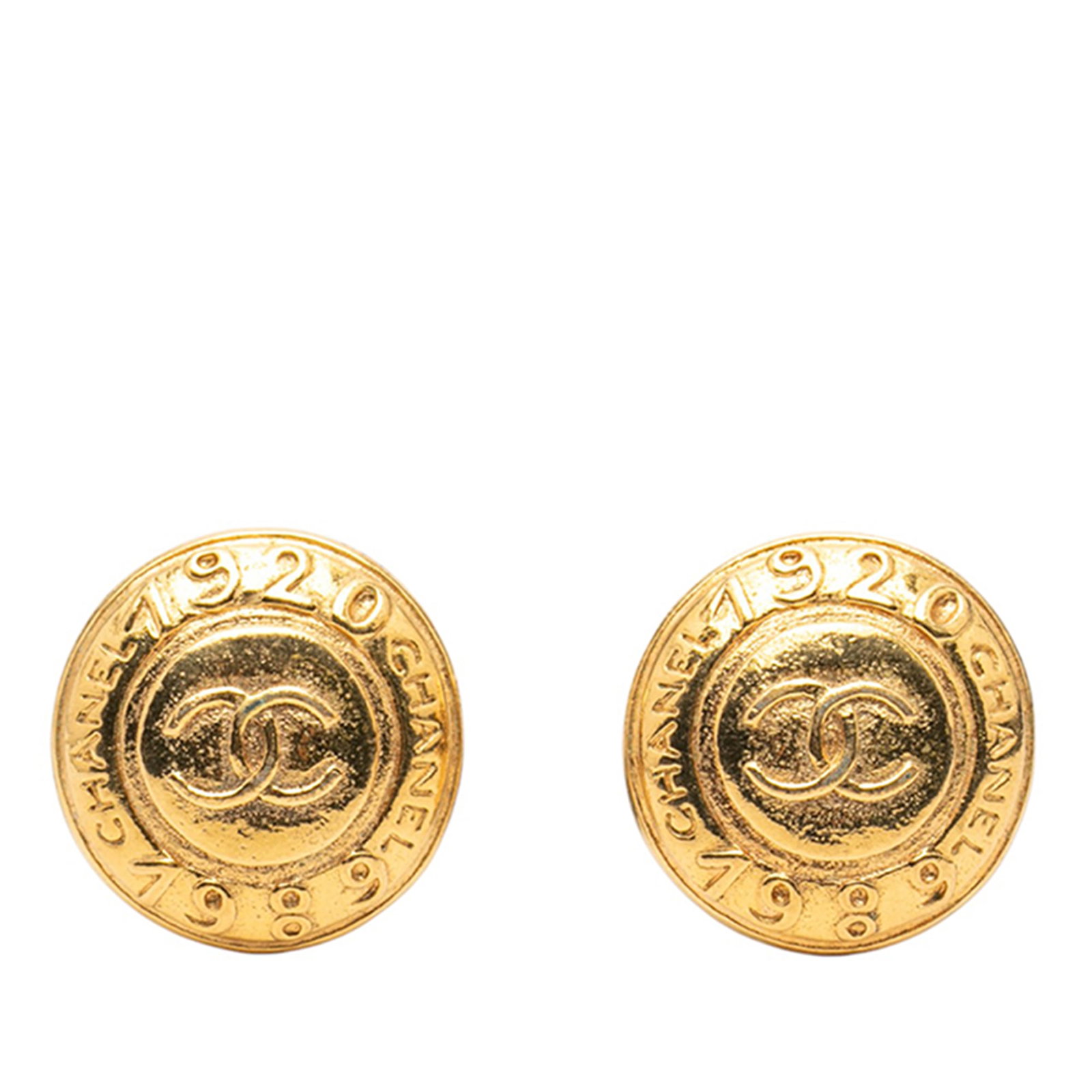 Chanel Round Gold Plated Clip On Costume Earrings: Chanel Round Gold Plated Clip On Costume Earrings These Chanel CC gold-plated round clip-on earrings feature gold-plated metal bodies and classic clip-on closures. The design is characterized by its r