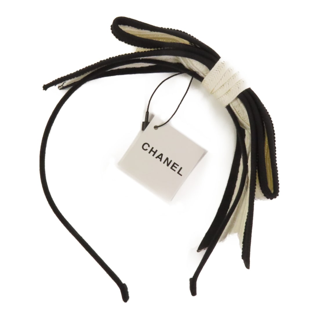 Chanel White and Black CC Logo Hair Accessory Papier Viscose Cotton: Chanel White and Black CC Logo Hair Accessory Papier Viscose Cotton This CHANEL CC hair band features a blend of papier, viscose, and cotton in a classic white and black color combination. Designed fo