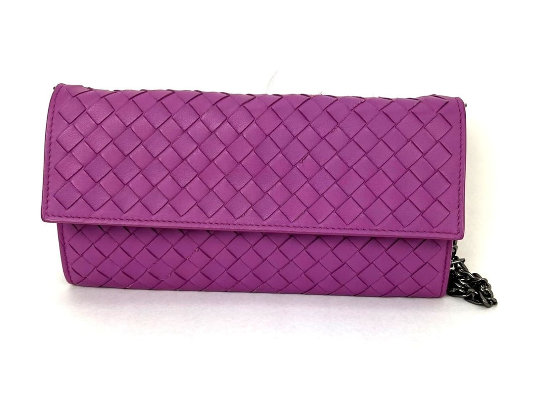 Pink Leather Intrecciato Continental Flap Wallet by Bottega Veneta: Pink Leather Intrecciato Continental Flap Wallet by Bottega Veneta This Bottega Veneta Nappa Intrecciato Continental Flap Wallet Clutch features a solid pink leather design with a signature woven patt