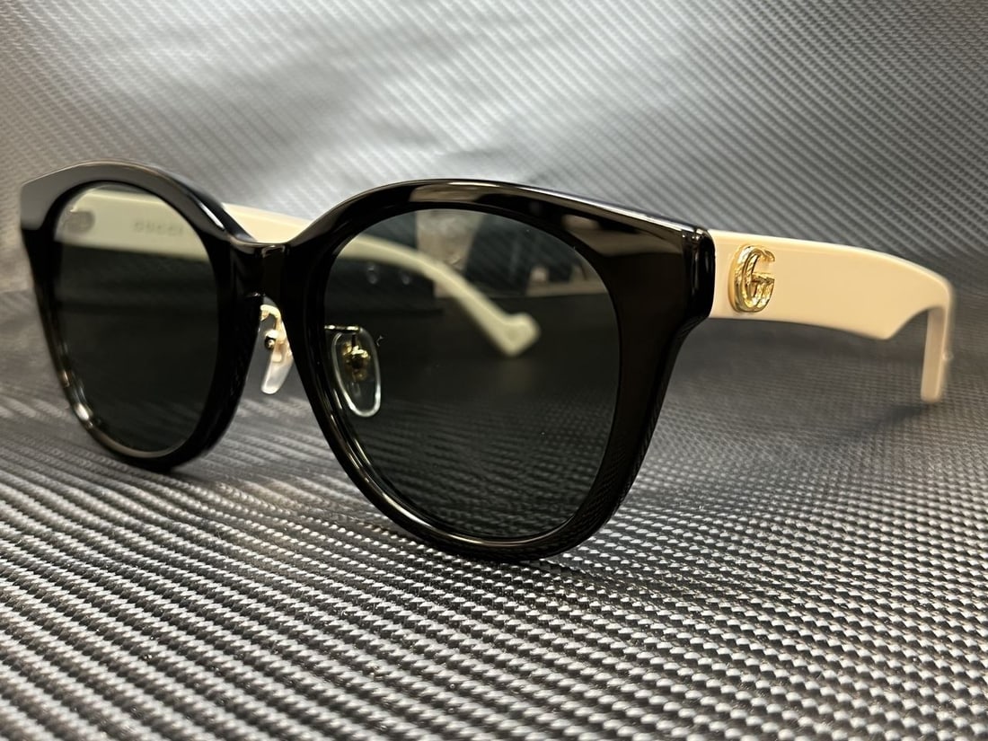 Gucci GG1002SK 004 Black Round Women's Sunglasses with Grey Lenses: Gucci GG1002SK 004 Black Round Women's Sunglasses with Grey Lenses Elevate your style with these Gucci GG1002SK 004 sunglasses. Featuring a sleek black round frame, these sunglasses are designed for w