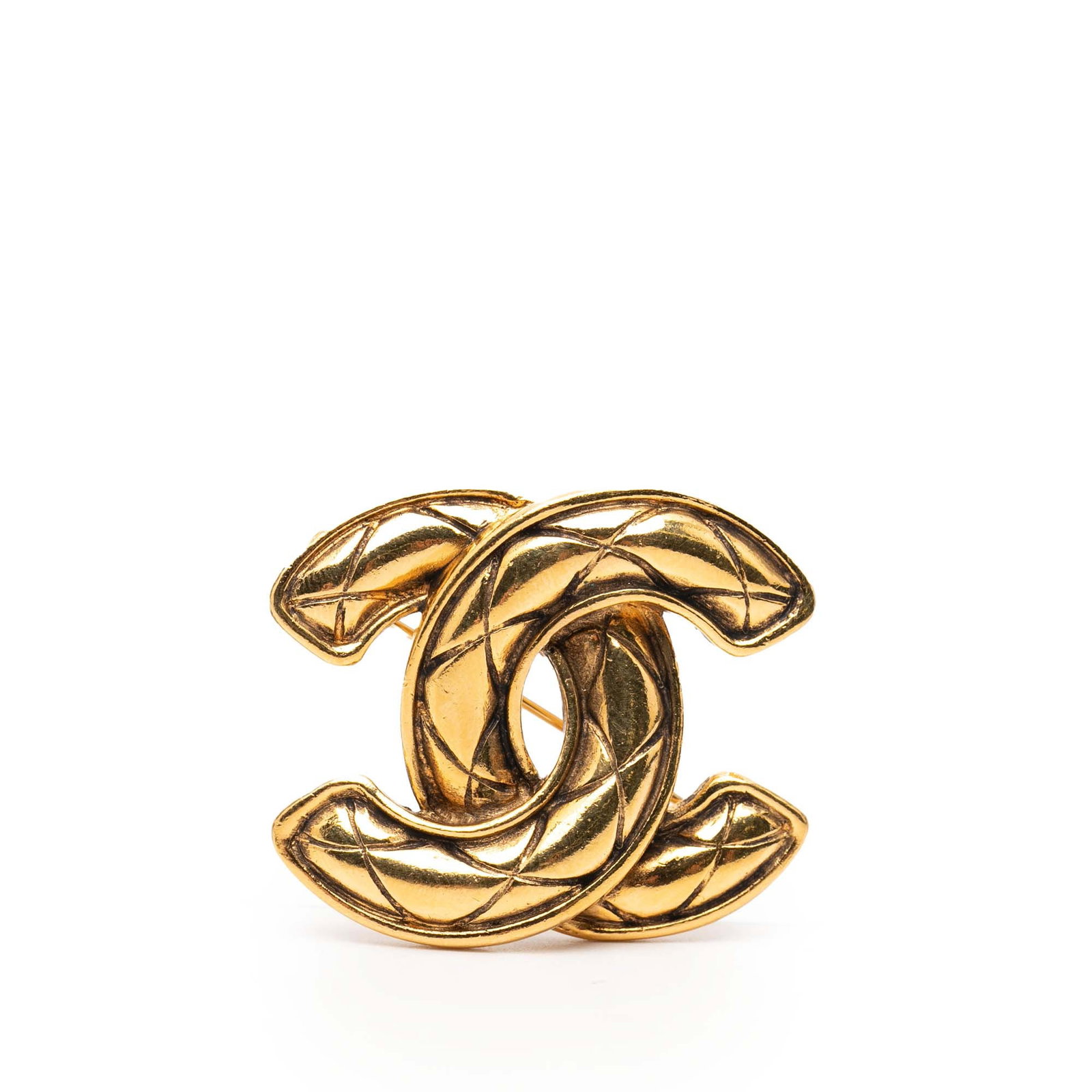 Chanel CC Logo Gold Tone Quilted Metal Brooch: Chanel CC Logo Gold Tone Quilted Metal Brooch This Chanel brooch features a gold-tone metal body with a classic quilted CC design and a back pin closure. Made in France, it is categorized as costume j