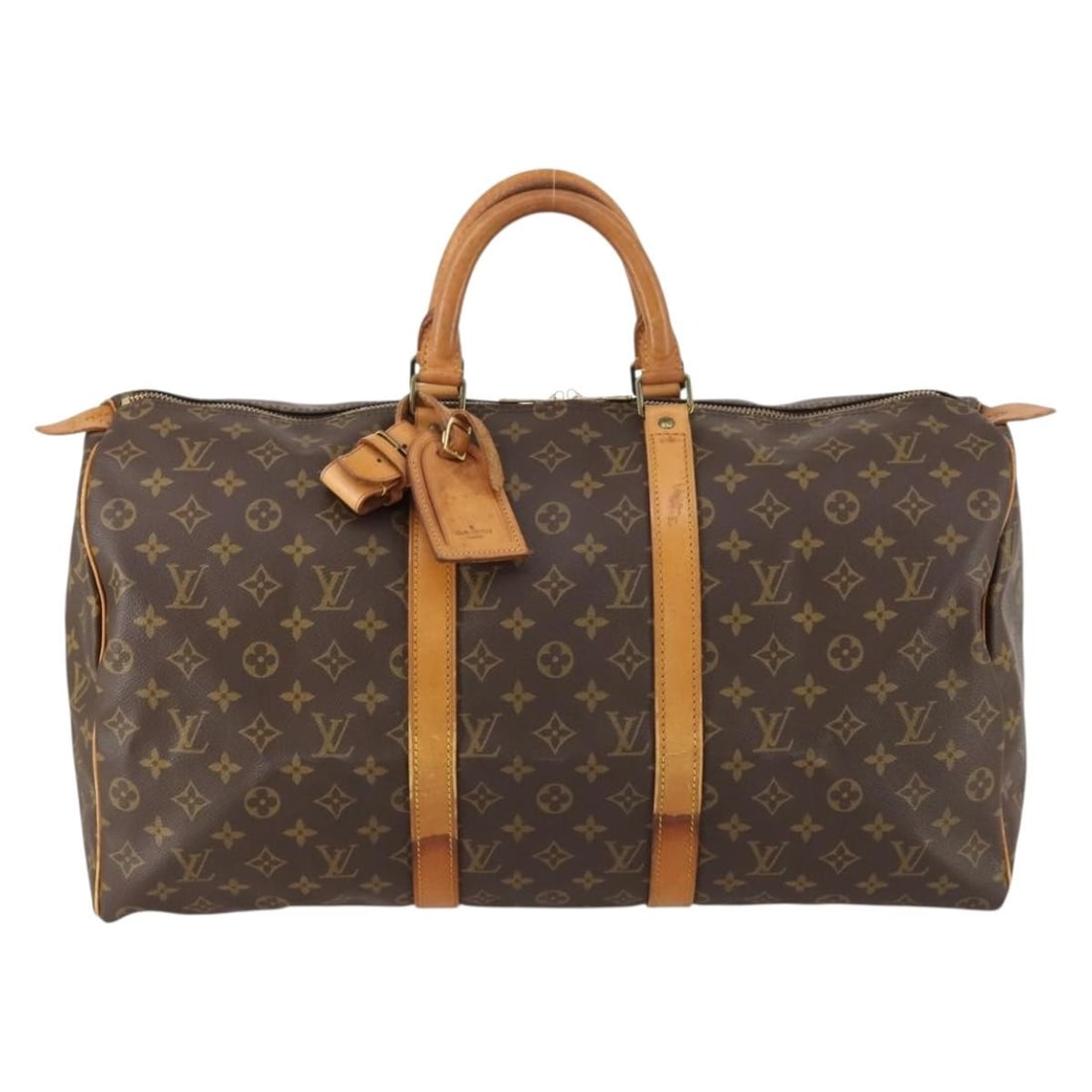 Keepall Monogram Canvas Travel Bag by Louis Vuitton: Keepall Monogram Canvas Travel Bag by Louis Vuitton This Louis Vuitton Keepall Bag features the iconic monogram canvas in brown, designed for unisex use. The bag shows signs of use, including loss of