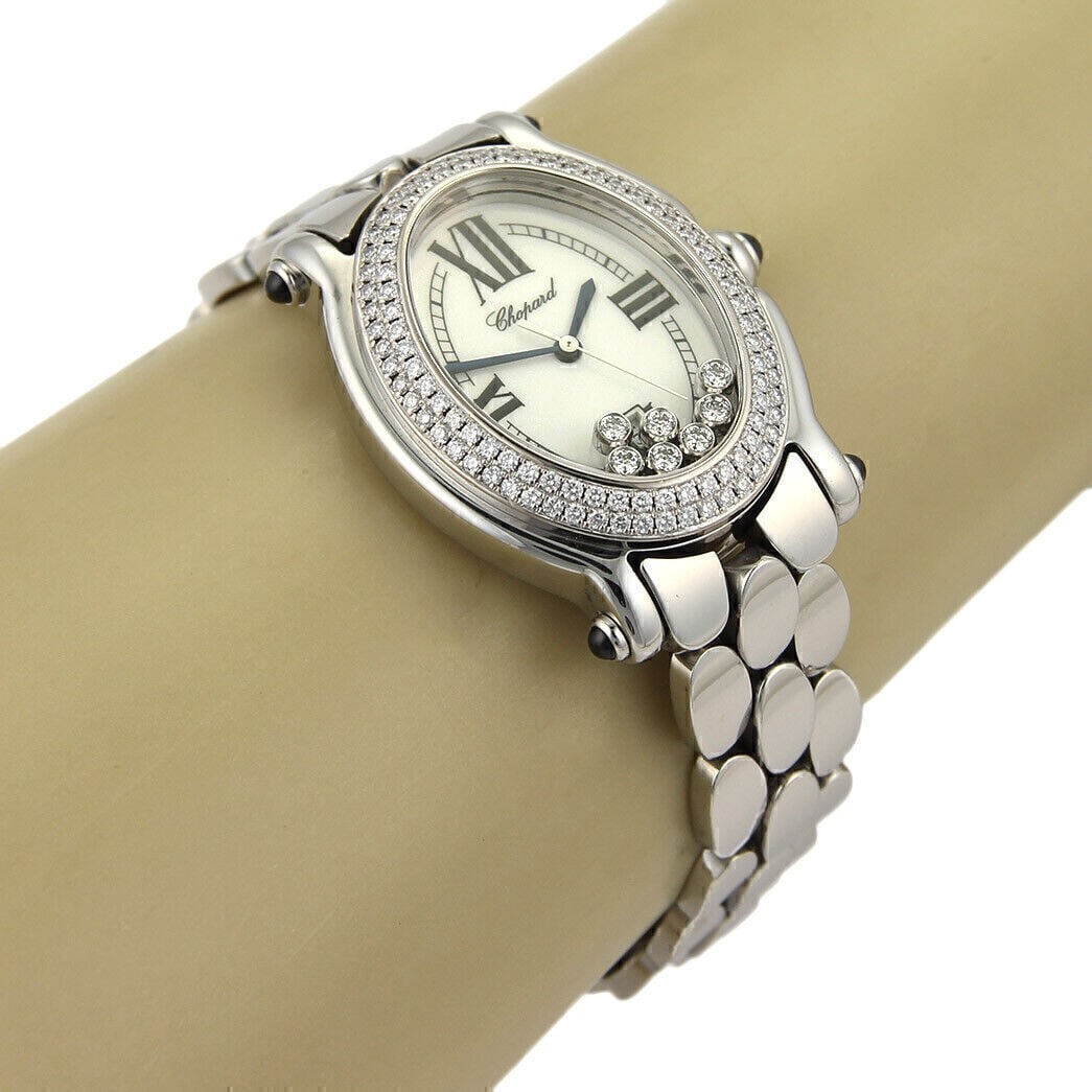 Chopard Happy Sport Oval Stainless Steel Ladies Watch with Seven Floating Diamonds: Chopard Happy Sport Oval Stainless Steel Ladies Watch with Seven Floating Diamonds This authentic Chopard Happy Sport Oval ladies wristwatch features a stainless steel case and band with an elegant ov