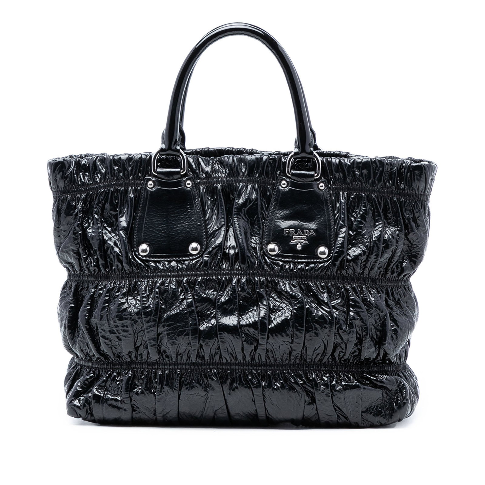 Black Patent Leather Satchel Vernice Gaufre by Prada: Black Patent Leather Satchel Vernice Gaufre by Prada This Prada Vernice Gaufre Satchel features a gathered patent leather exterior with rolled top handles and a top zip closure. The interior includes