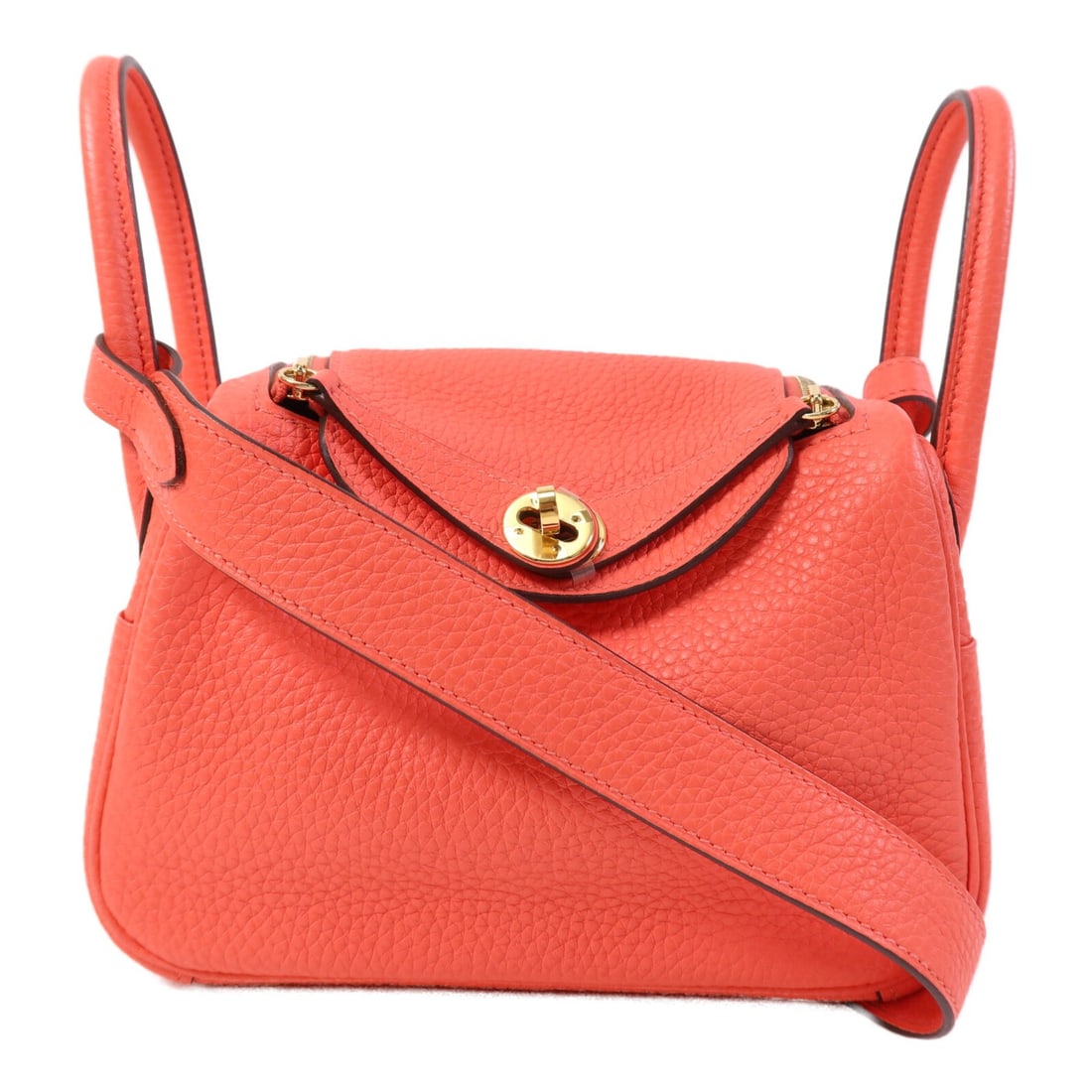 Rose Texas Clemence Leather Mini Lindy Shoulder Bag with Gold Hardware by Hermes: Rose Texas Clemence Leather Mini Lindy Shoulder Bag with Gold Hardware by Hermes This Hermes Mini Lindy 2-way shoulder bag is crafted from Clemence calfskin leather in a pink hue. Featuring a compact