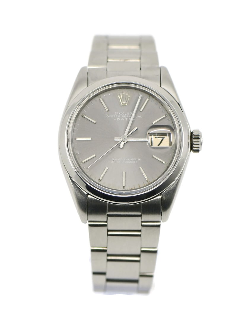 Rolex Oyster Perpetual 1500 Stainless Steel Watch with Box and Papers: Rolex Oyster Perpetual 1500 Stainless Steel Watch with Box and Papers This exquisite Rolex Oyster Perpetual wristwatch is a stunning example of precision craftsmanship from the renowned brand. Manufac