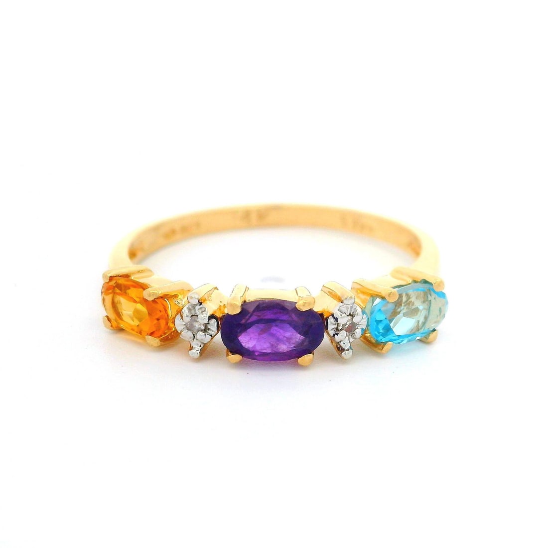 14k Yellow Gold Multi-Stone Ring with Citrine Amethyst Topaz Diamonds: 14k Yellow Gold Multi-Stone Ring with Citrine Amethyst Topaz Diamonds This stunning 14k Yellow Gold band ring showcases a colorful array of natural gemstones, making it a perfect statement piece. The